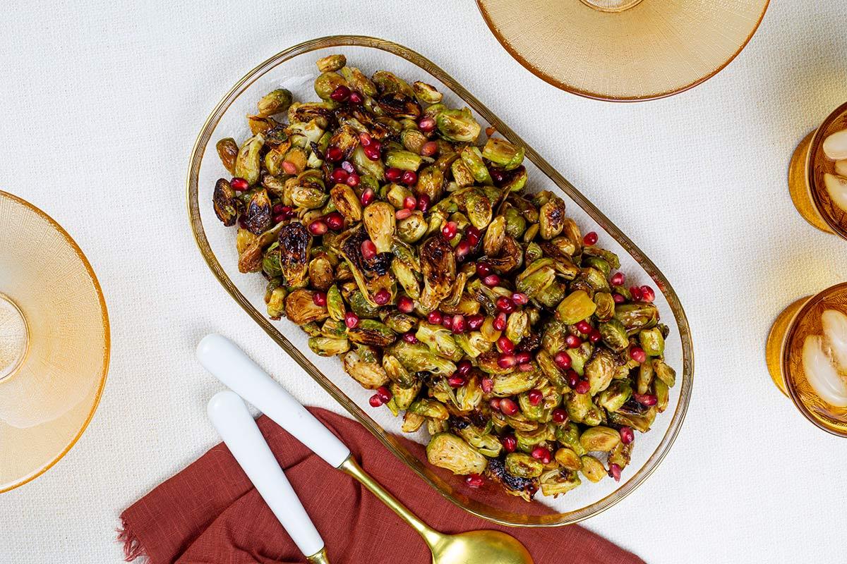 Marukan Crispy Brussels Sprouts with Sudachi Ponzu Glaze and Pomegranate Seeds